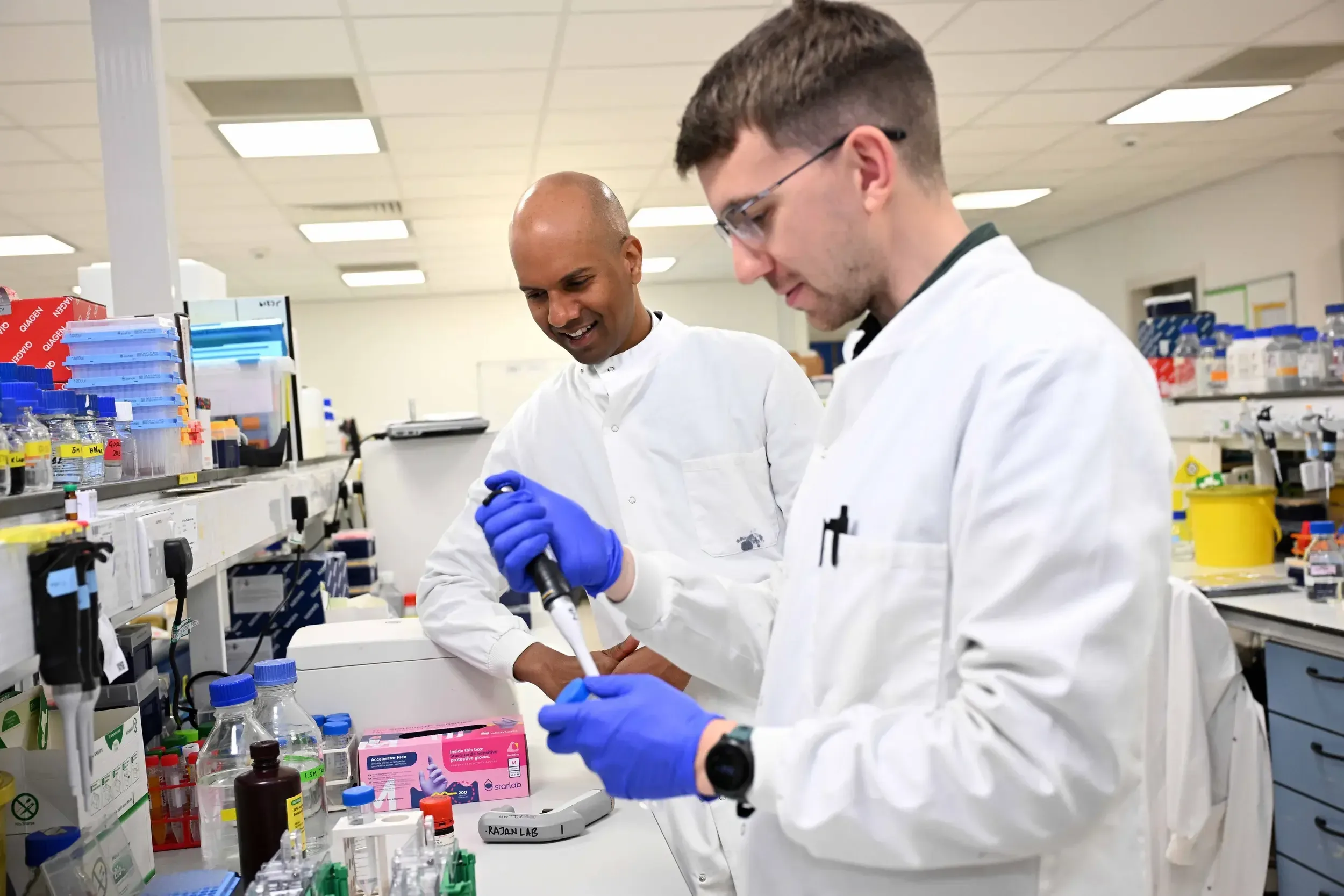 Dr Neil Rajan, a researcher at Newcastle University Medical School is pictured with his colleague Joe in a lab.