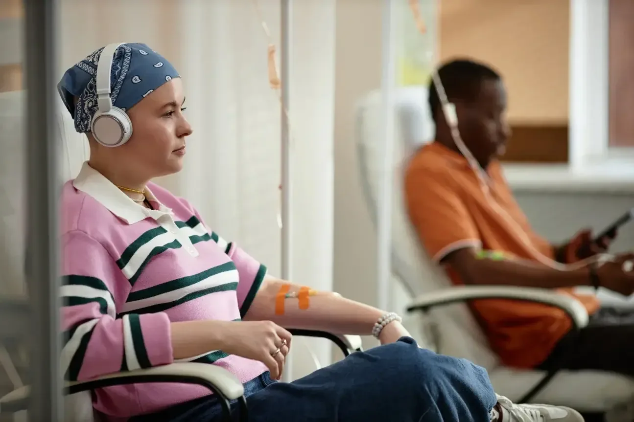 Two People Getting Chemotherapy Treatment in Clinic stock photo
