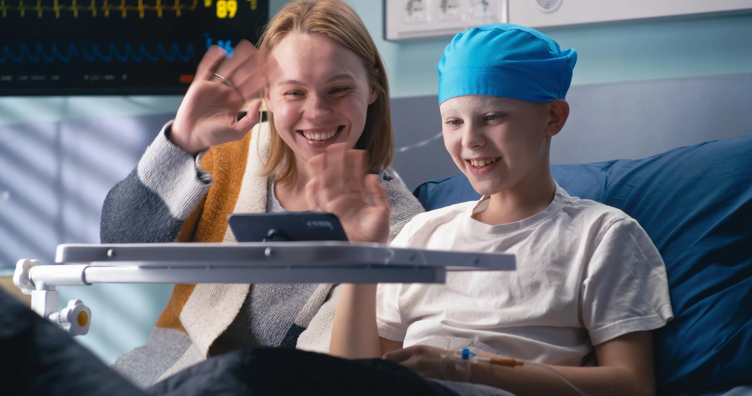 Young cancer patient and family member on video call