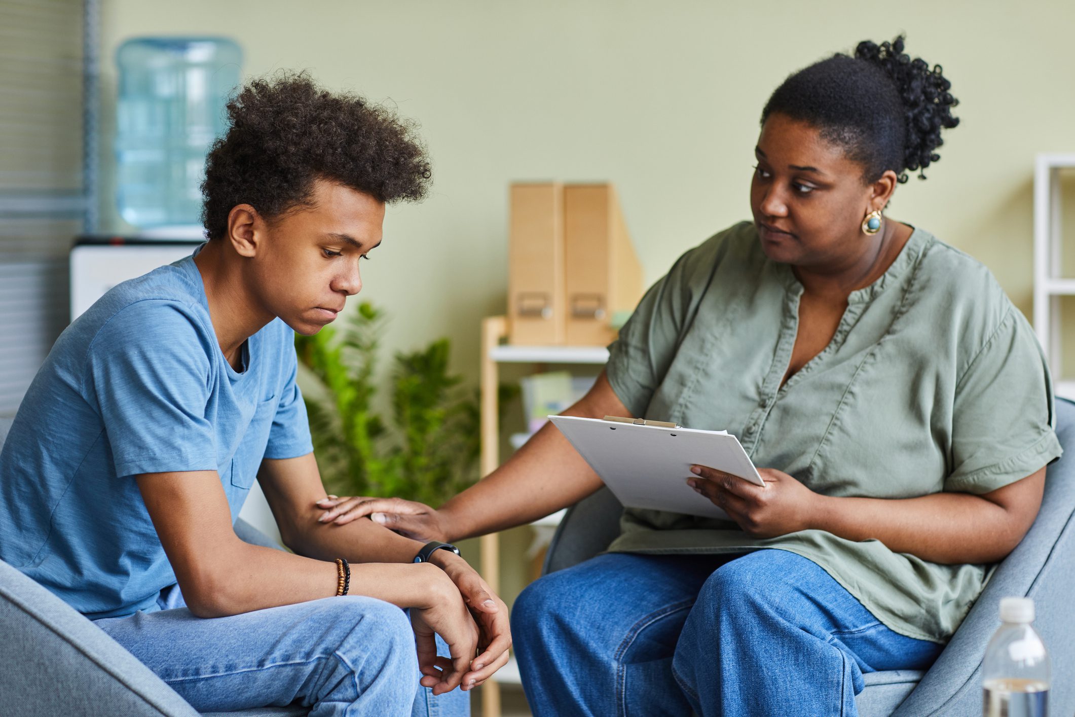Psychologist speaks to teenage boy